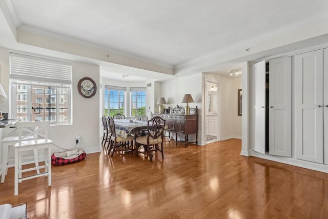 20 Chapel St Unit B811, Brookline, MA 02446 - dining space with ornamental molding, wood finished floors, and baseboards