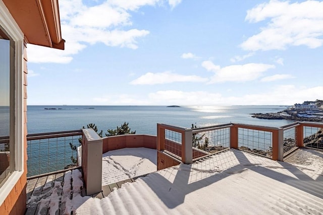 wooden terrace with a water view