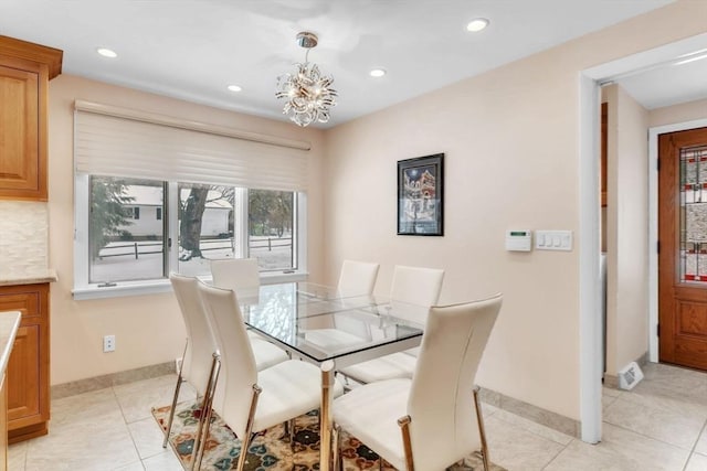 dining area featuring a chandelier, recessed lighting, baseboards, and light tile patterned floors