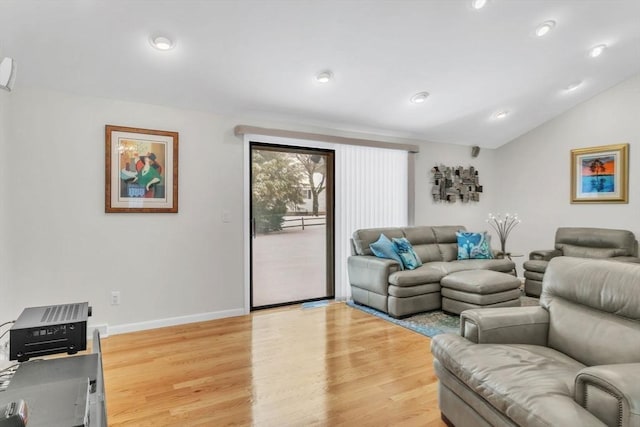 living area with light wood-style flooring, baseboards, vaulted ceiling, and recessed lighting