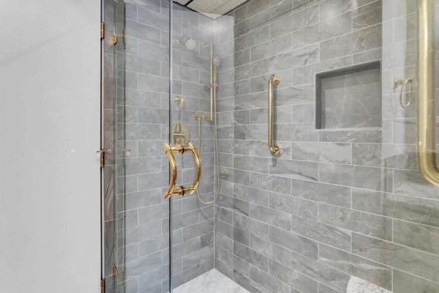 bathroom with tiled shower