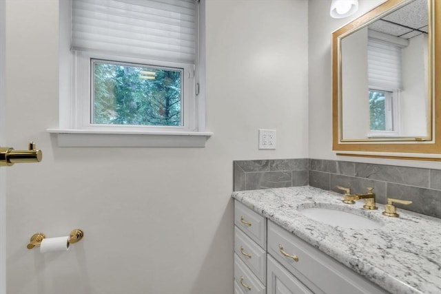 bathroom with backsplash and vanity