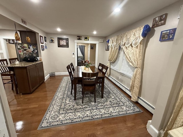 dining area with a baseboard radiator, dark wood-style flooring, baseboards, and recessed lighting