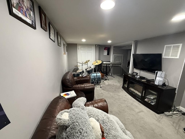 carpeted living room with recessed lighting and visible vents