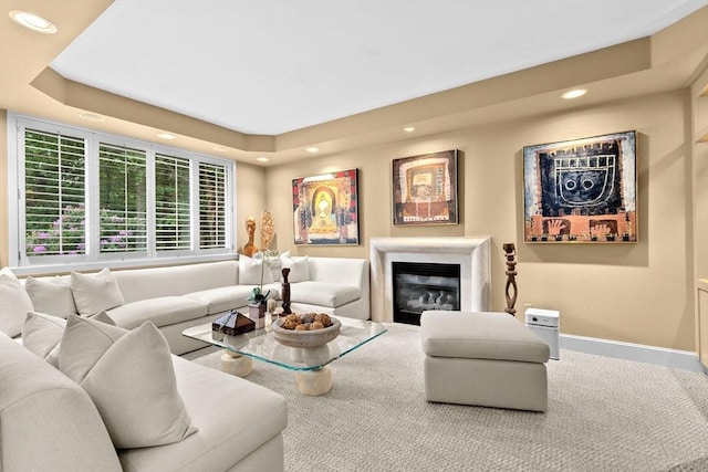 202 Allandale Rd Unit A, Boston, MA 02467 - living area with recessed lighting, carpet flooring, a glass covered fireplace, a tray ceiling, and baseboards