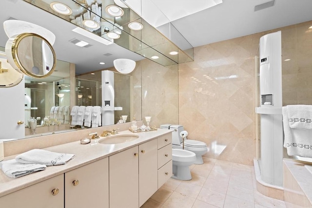 202 Allandale Rd Unit A, Boston, MA 02467 - bathroom featuring tile walls, a bidet, tile patterned flooring, vanity, and toilet
