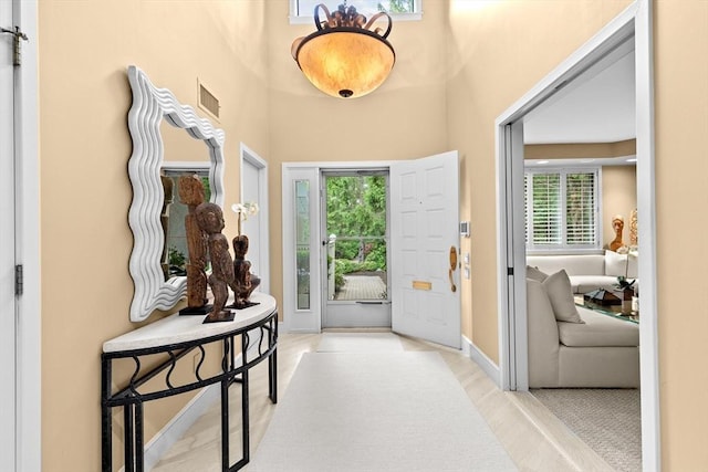 202 Allandale Rd Unit A, Boston, MA 02467 - foyer entrance with light wood-style floors and baseboards