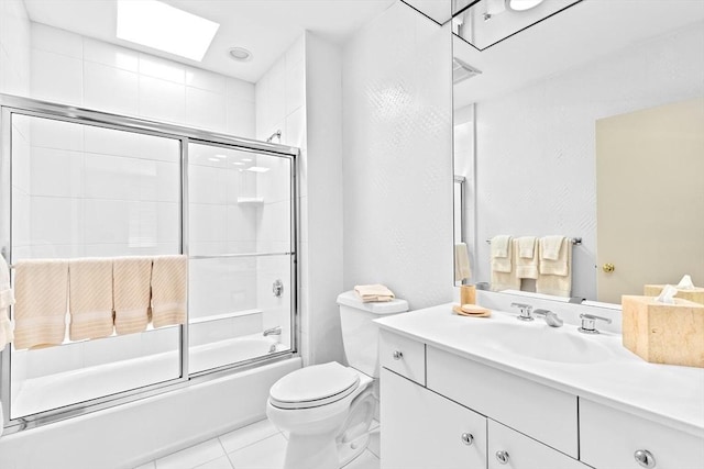 202 Allandale Rd Unit A, Boston, MA 02467 - bathroom featuring vanity, bath / shower combo with glass door, toilet, and a skylight