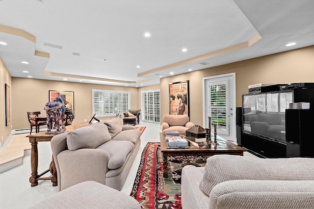 202 Allandale Rd Unit A, Boston, MA 02467 - living area featuring a raised ceiling, a baseboard heating unit, recessed lighting, and plenty of natural light