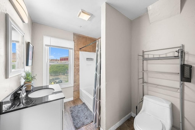 150 Belmont St, Worcester, MA 01605 - full bath with vanity, wood finished floors, toilet, shower / tub combination, and baseboards