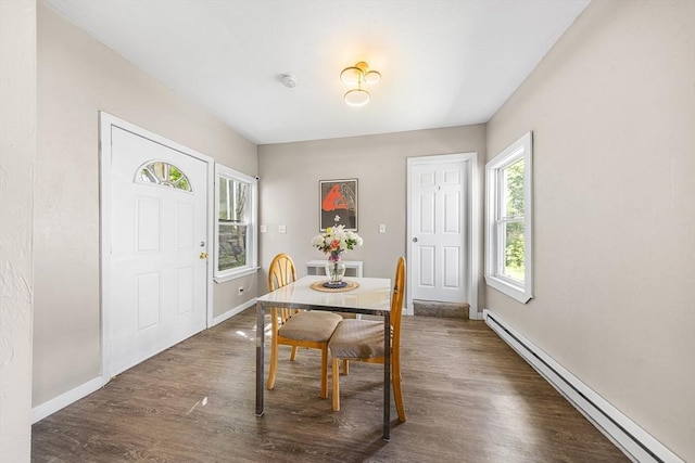 150 Belmont St, Worcester, MA 01605 - dining room featuring baseboard heating, baseboards, and wood finished floors