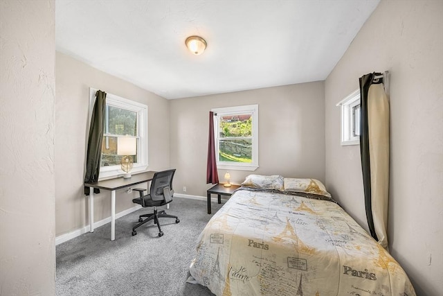 150 Belmont St, Worcester, MA 01605 - carpeted bedroom featuring multiple windows, baseboards, and an office area
