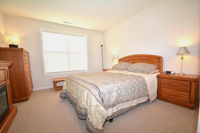 bedroom with light colored carpet