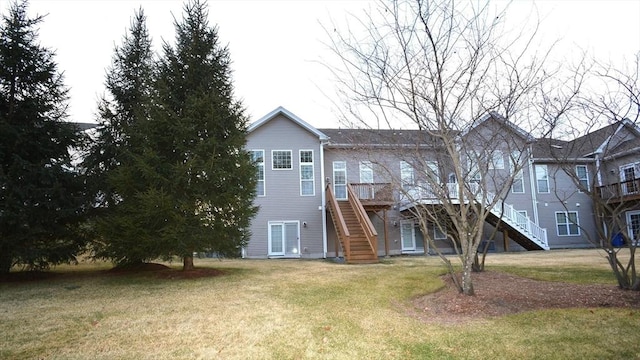 back of house featuring a lawn