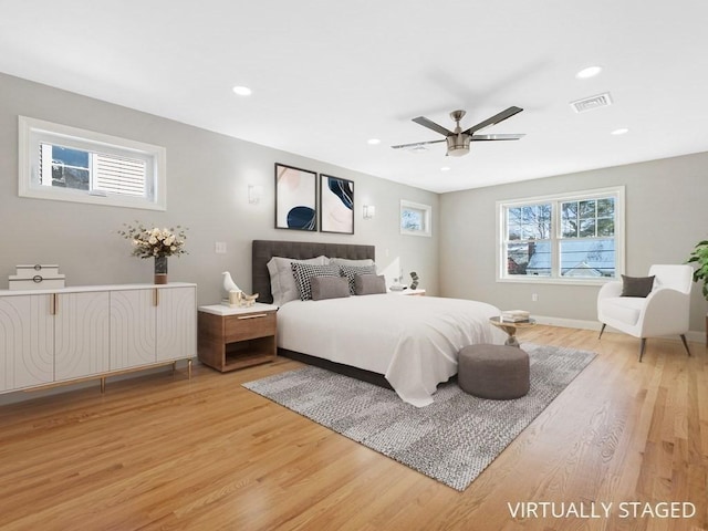 bedroom with ceiling fan and wood-type flooring