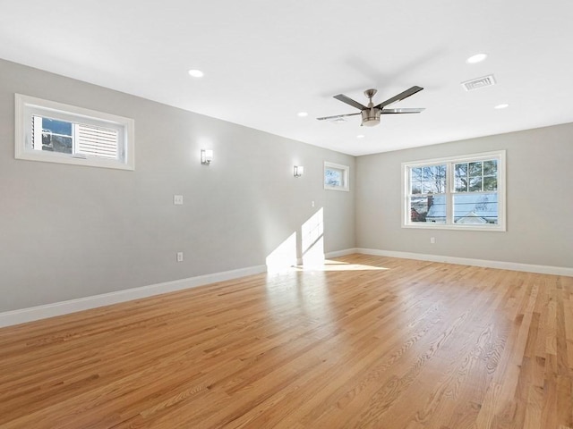 empty room featuring light wood-type flooring and ceiling fan