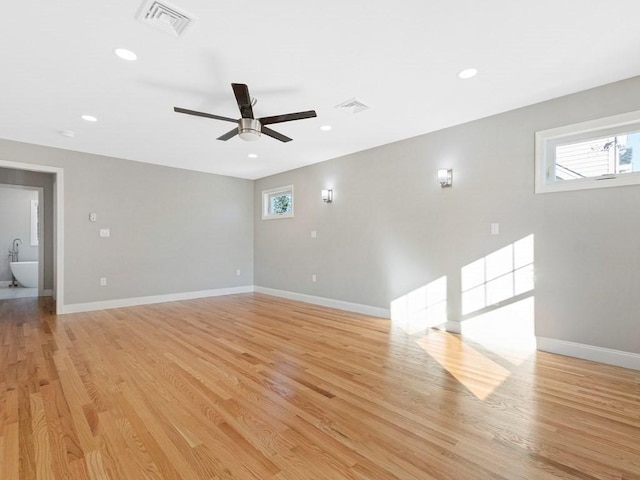 spare room featuring ceiling fan and light hardwood / wood-style floors