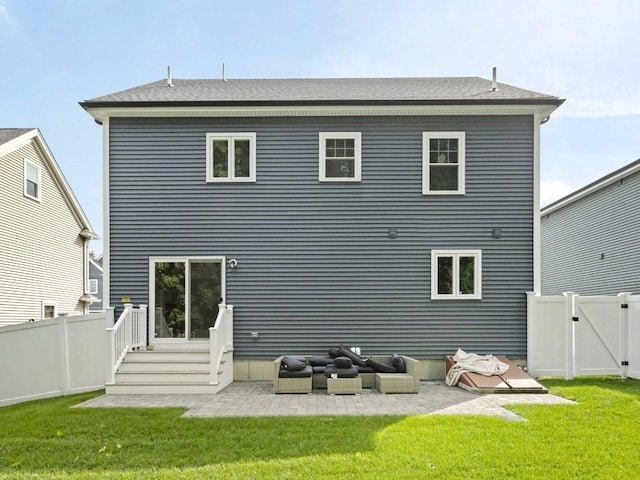 back of property with a lawn, an outdoor living space, and a patio