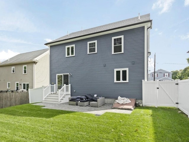 back of house with a yard and a patio area