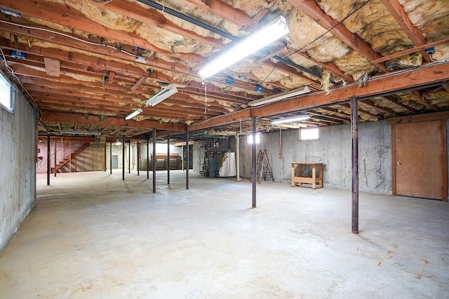 unfinished below grade area featuring stairs