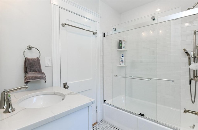 full bath featuring vanity and enclosed tub / shower combo