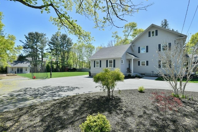 view of front of property with a front lawn