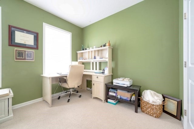 office with light colored carpet and baseboards