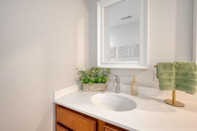 bathroom with visible vents and vanity