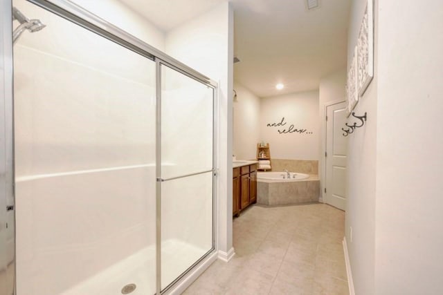 bathroom featuring a stall shower, baseboards, tile patterned floors, vanity, and a bath