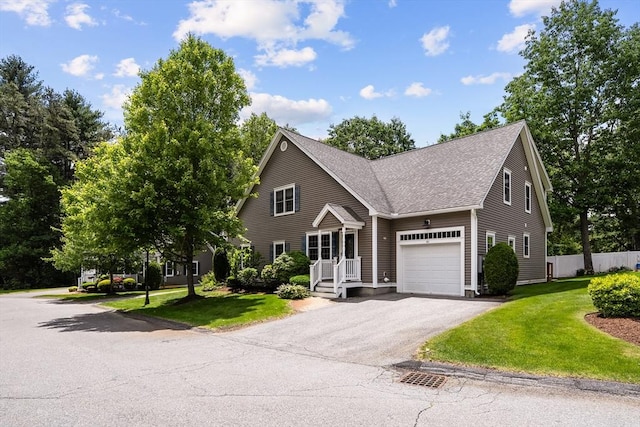 41 Winter Ln Unit 41, Tewksbury, MA 01876 - view of front of property featuring a garage, roof with shingles, and driveway
