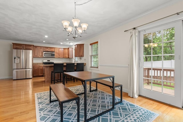 41 Winter Ln Unit 41, Tewksbury, MA 01876 - dining space featuring a chandelier, ornamental molding, light wood-style floors, baseboards, and recessed lighting
