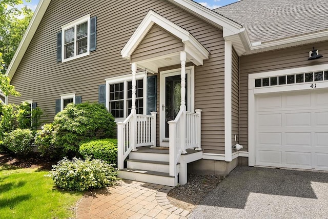 41 Winter Ln Unit 41, Tewksbury, MA 01876 - doorway to property featuring roof with shingles and a garage