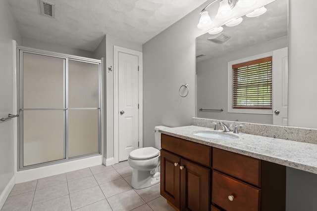 41 Winter Ln Unit 41, Tewksbury, MA 01876 - bathroom with vanity, a shower stall, toilet, tile patterned floors, and baseboards