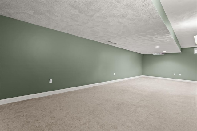 41 Winter Ln Unit 41, Tewksbury, MA 01876 - spare room featuring a textured ceiling, carpet flooring, and baseboards