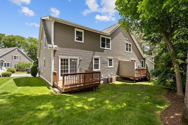 41 Winter Ln Unit 41, Tewksbury, MA 01876 - back of property featuring a wooden deck, a yard, and central AC
