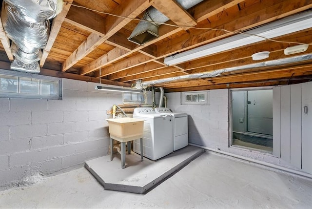 laundry room featuring separate washer and dryer and sink