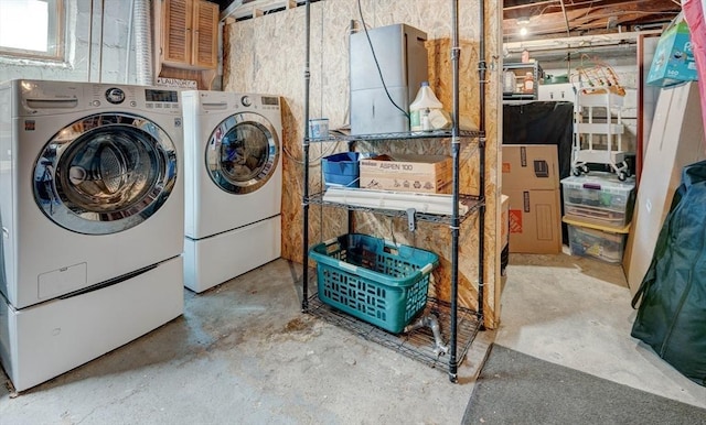 clothes washing area with laundry area and washer and dryer