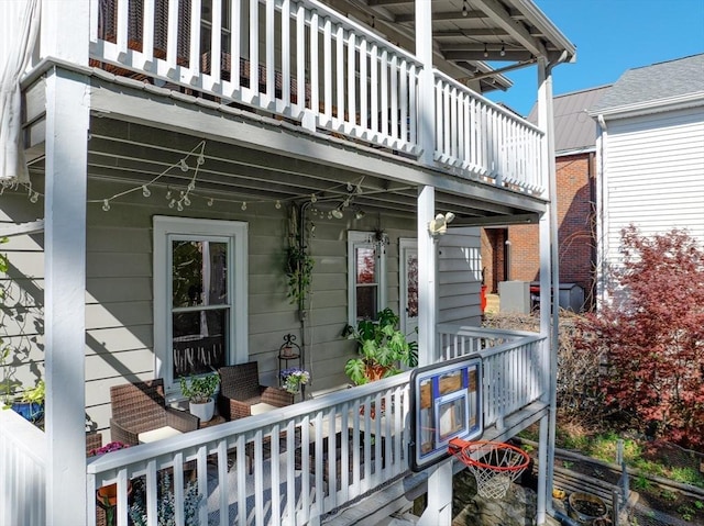 exterior space featuring a balcony and covered porch