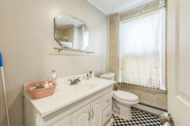 bathroom with a baseboard radiator, toilet, and vanity