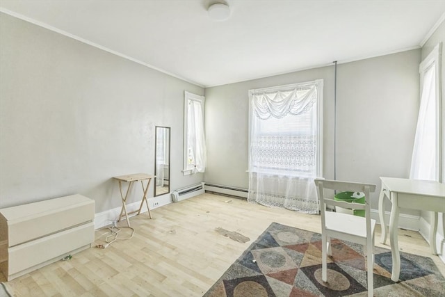 home office featuring wood finished floors, crown molding, baseboards, and a baseboard radiator