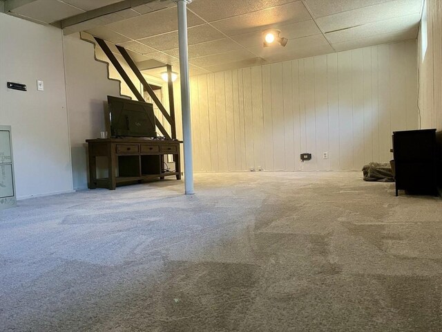 16 Douglas Ave, Beverly, MA 01915 - unfurnished living room with carpet flooring, a drop ceiling, and wooden walls