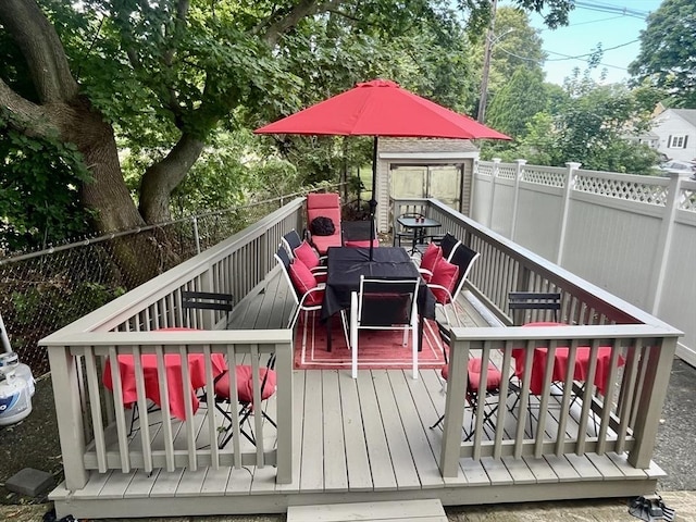 16 Douglas Ave, Beverly, MA 01915 - wooden deck featuring outdoor dining area and a fenced backyard