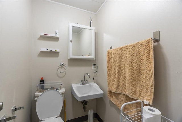 51 Prospect St, Webster, MA 01570 - bathroom featuring ornamental molding, toilet, and a sink