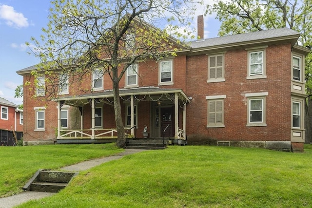 51 Prospect St, Webster, MA 01570 - view of front of home with a chimney, brick siding, a front yard, and covered porch