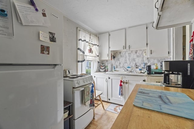 51 Prospect St, Webster, MA 01570 - kitchen with white appliances, a sink, light countertops, white cabinetry, and a textured ceiling