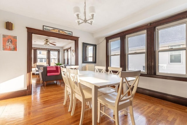 dining room with a notable chandelier and light hardwood / wood-style floors