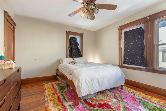 bedroom featuring ceiling fan and hardwood / wood-style floors