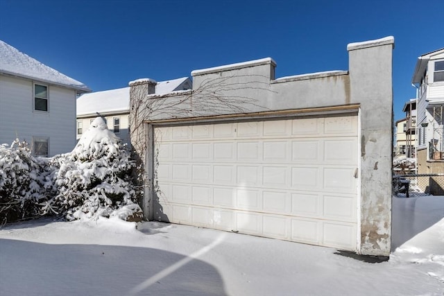 view of snow covered garage