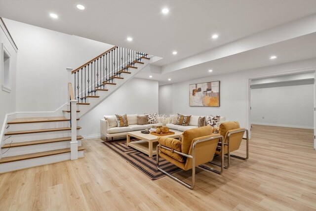 living room with light hardwood / wood-style flooring