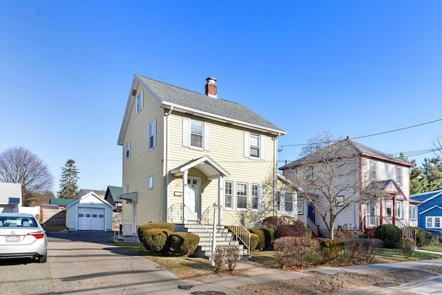 view of front of home with an outbuilding and a garage